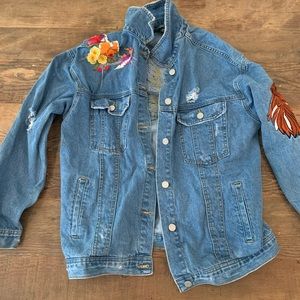 Patched and embroidered denim jacket